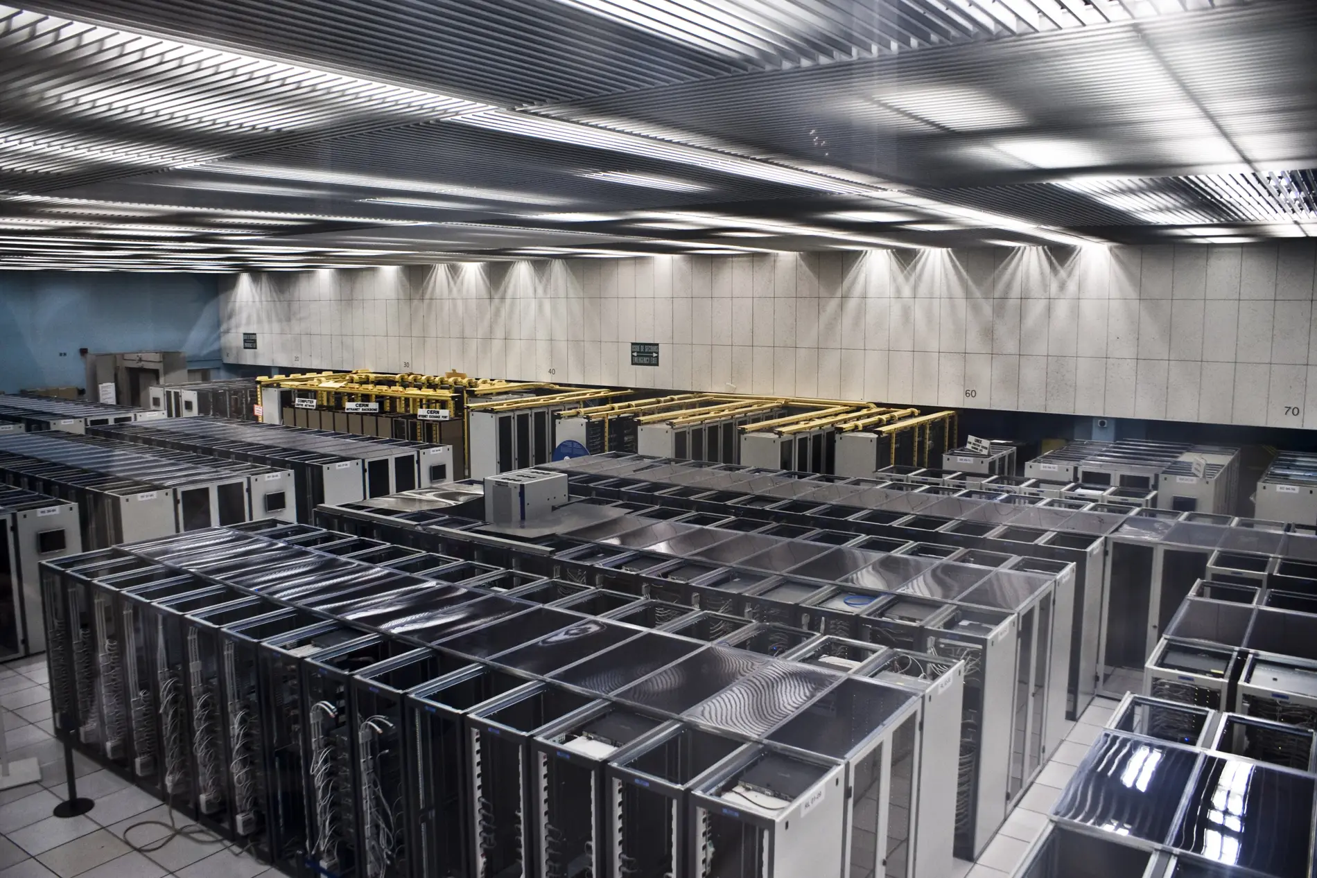 Rows of server racks in a large data hall